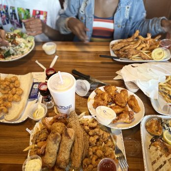 Orleans Seafood Kitchen - a table full of food - Cajun/Creole Near Me - Katy, Texas Orleans Seafood Kitchen - a table full of food - Cajun/Creole Near Me - Katy, Texas