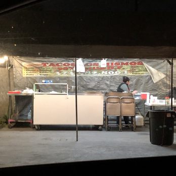 Tacos Los Mismos - a man preparing food under a tent - Tacos Near Me - Los Angeles, California Tacos Los Mismos - a man preparing food under a tent - Tacos Near Me - Los Angeles, California