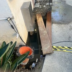 Park Ocean Condominium Homeowners Assn - Just some open manholes filled with water next to electrical chords plugged in, in a public area. That have been here for months.
