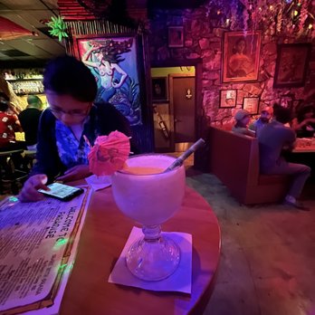 Lei Low - Inside of restaurant and the barefoot in the sand - Cocktail Bars Near Me - Houston, Texas