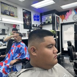 Premier Barbershop Hawaii - Mid skin fade by Riley B