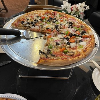 Roma's Italian Bistro - Medium specialty pizza. Everything but anchovies, jalapeños or pineapple. Excellent! - Italian Near Me - Grand Prairie, Texas Roma's Italian Bistro - Medium specialty pizza. Everything but anchovies, jalapeños or pineapple. Excellent! - Italian Near Me - Grand Prairie, Texas