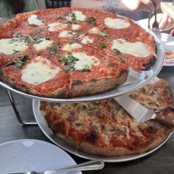 The Beacon Pizza Bar - Margarita pizza on top and sausage and mushrooms on the bottom. - Pizza Near Me - Beacon Falls, Connecticut The Beacon Pizza Bar - Margarita pizza on top and sausage and mushrooms on the bottom. - Pizza Near Me - Beacon Falls, Connecticut