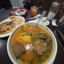 Sopa/caldo de res y una pupusa revuelta ( chicharrón y queso) Sopa/caldo de res y una pupusa revuelta ( chicharrón y queso)