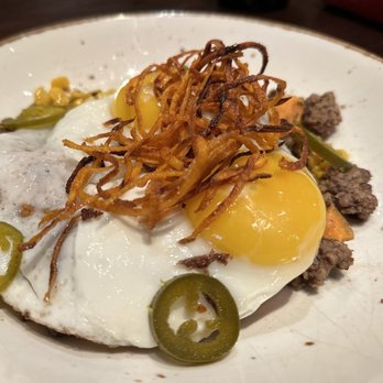 Cast Iron - a plate of food with a fried egg and jalapenos - Southern Near Me - Fort Worth, Texas