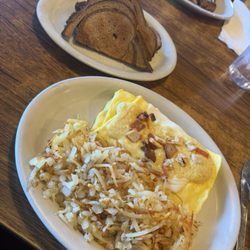 Turkey Club omelet with hashbrowns and rye toast.