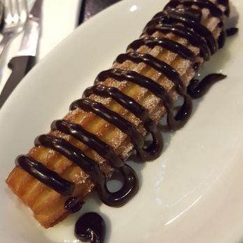 Churros Calientes - churro grande - filled with sweet and condensed milk, topped with chocolate - Cafes Near Me - Los Angeles, California Churros Calientes - churro grande - filled with sweet and condensed milk, topped with chocolate - Cafes Near Me - Los Angeles, California