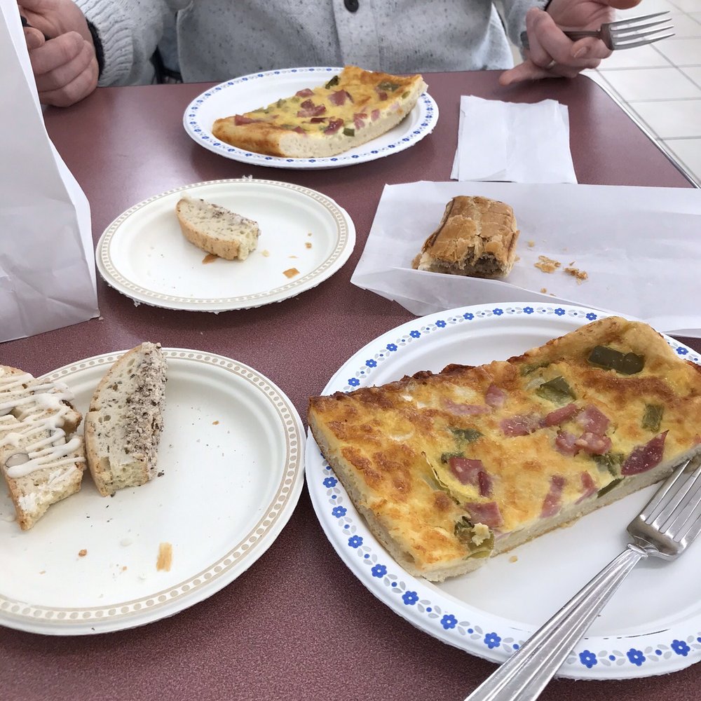 Our breakfast: biscotti, sausage roll and egg, pepper and ham pizza - we shared 1 slice cut in half!