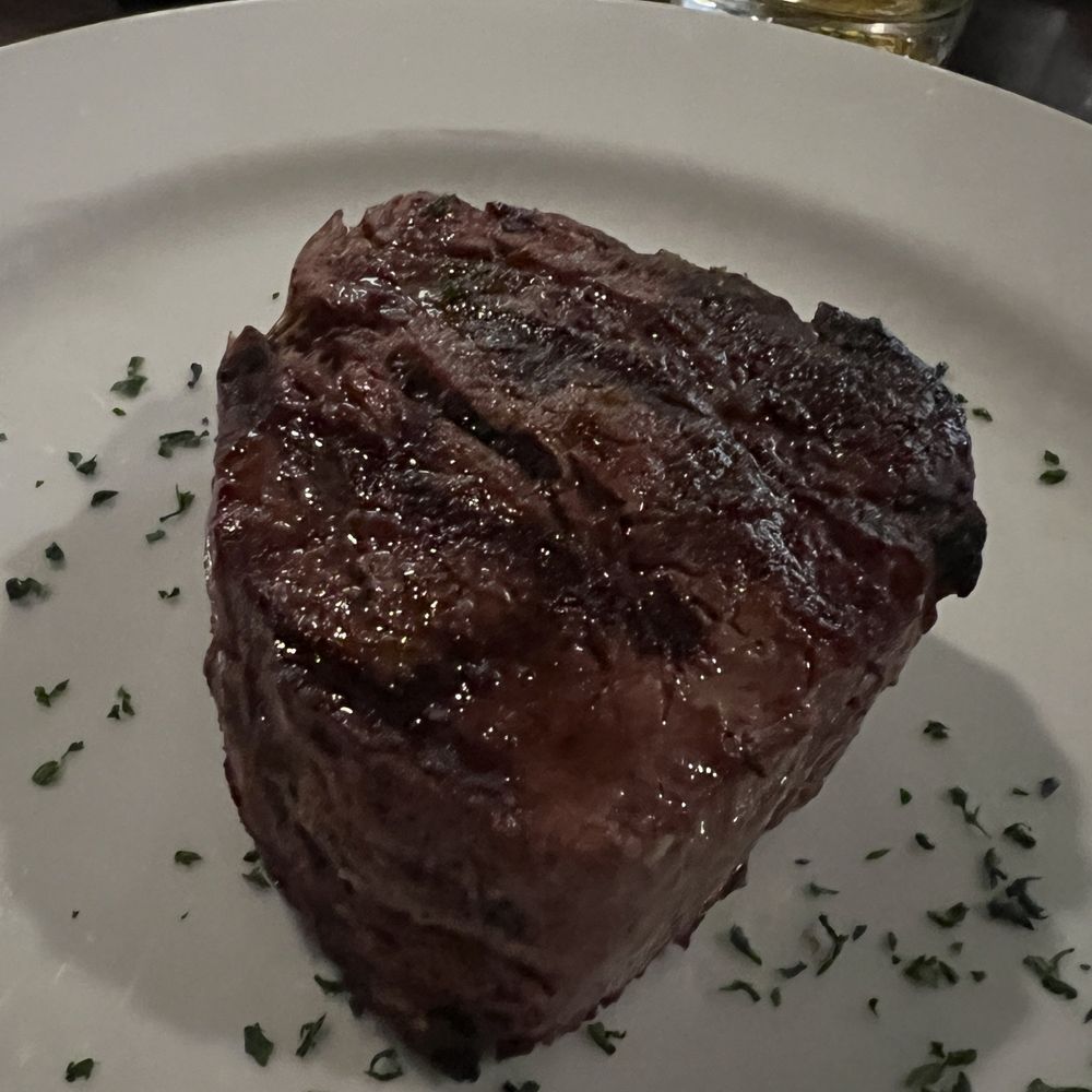 Filet Mignon 10oz cooked medium. Perfectly cooked. Light crust on the outside and so juicy on the inside.