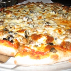 Medium pizza with sausage and olives