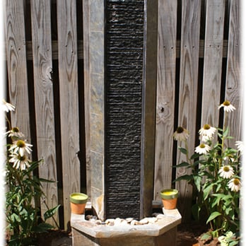 Edible Landscapes - a fountain in a garden - Tree Services Near Me Edible Landscapes - a fountain in a garden - Tree Services Near Me