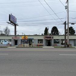 Hans's Place - Front of building on S Tacoma Way. Can park in front or park in parking lot behind & enter from behind.