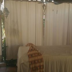 Venus Moon Southsidespa - Rooftop massage bed with curtains closed for privacy
