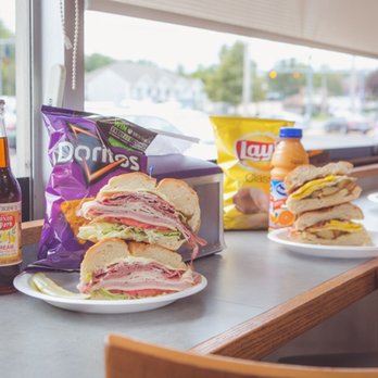 Bert's Deli - a sandwich and chips on a table - Delis Near Me - Milford, Connecticut Bert's Deli - a sandwich and chips on a table - Delis Near Me - Milford, Connecticut