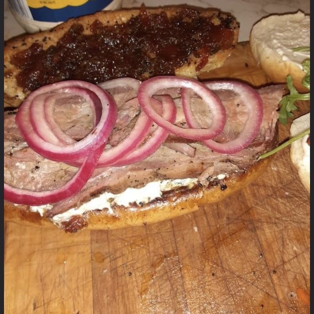 Jones Smokehouse BBQ - a roast beef sandwich on a cutting board - Barbeque Near Me - Spokane, Washington Jones Smokehouse BBQ - a roast beef sandwich on a cutting board - Barbeque Near Me - Spokane, Washington