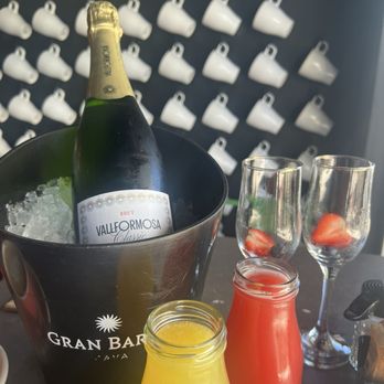Bistro Cafe - Mimosas with a bottle and two freshly prepared juices (watermelon and orange). Delicious! - Puerto Rican Near Me - San Juan, Puerto Rico Bistro Cafe - Mimosas with a bottle and two freshly prepared juices (watermelon and orange). Delicious! - Puerto Rican Near Me - San Juan, Puerto Rico