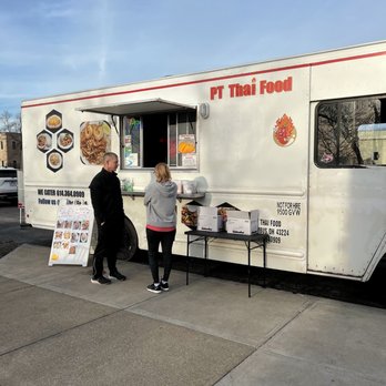 PT Thai Food - two people ordering food from a food truck - Food Trucks Near Me - Columbus, Ohio PT Thai Food - two people ordering food from a food truck - Food Trucks Near Me - Columbus, Ohio