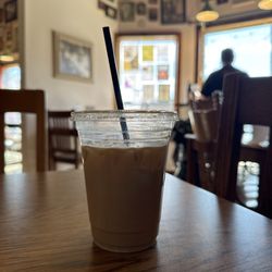 The Wired Rooster Coffee Shoppe - Partially drunk iced vanilla latte.