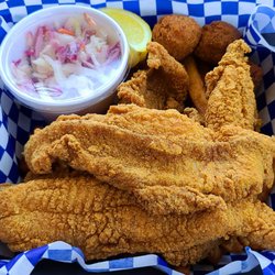 The Fish Fry - 4 piece catfish with slaw, fries, and hushpuppies. Delicious!!