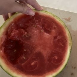The watermelon was very dark, jelly-like, and disintegrated when you touched it. Rotten.