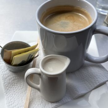 Cafe La Flore - Cafe Americano with a side of almond milk - Coffee & Tea Near Me - San Francisco, California Cafe La Flore - Cafe Americano with a side of almond milk - Coffee & Tea Near Me - San Francisco, California