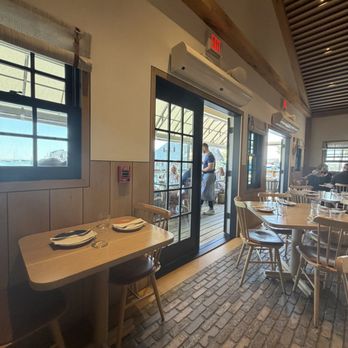 Straight Wharf Fish - Inside with view of deck - Seafood Near Me - Nantucket, Massachusetts