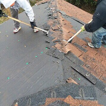American Remodeling , Roofing & Concrete Specialists - Mike's crew diligently scraping away our old roof. - Roofing Near Me