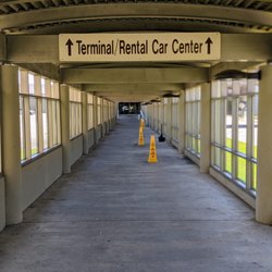 Hertz Rent A Car - Walkway to the Rental Car Center from parking lot.