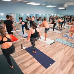 Yoga Sol - Dandayamana janu shirasana (Standing Head to Knee) in a 26&2 Hot Yoga class.