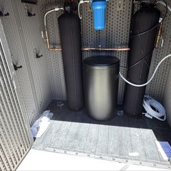 Reliable Plumbers Plumbing Services - Water softener installed in to the storage