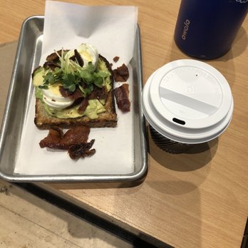 Press Coffee - the Roastery - Bacon and eggs avocado toast - half order aka 1 slice (it is cut in half diagonally - Coffee & Tea Near Me - Phoenix, Arizona Press Coffee - the Roastery - Bacon and eggs avocado toast - half order aka 1 slice (it is cut in half diagonally - Coffee & Tea Near Me - Phoenix, Arizona