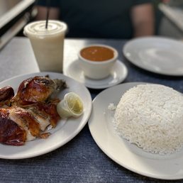Rotisserie chicken with white rice, beans and Garlic sauce on the side. Hennessy colada Rotisserie chicken with white rice, beans and Garlic sauce on the side. Hennessy colada