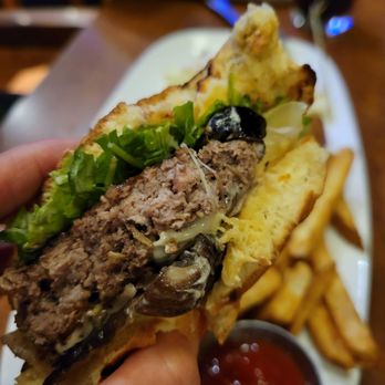 White Spot - a person holding a sandwich and french fries - Canadian (New) Near Me - Squamish, British Columbia White Spot - a person holding a sandwich and french fries - Canadian (New) Near Me - Squamish, British Columbia
