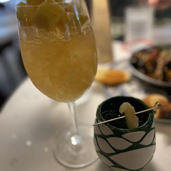 Mexican Sugar Austin Domain - Ancho Chile Sour topped w/mango pieces and Mexican Mezcal Mule - Latin American Near Me - Austin, Texas Mexican Sugar Austin Domain - Ancho Chile Sour topped w/mango pieces and Mexican Mezcal Mule - Latin American Near Me - Austin, Texas