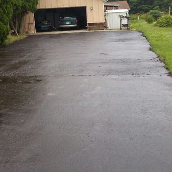 S&S Paving - a driveway with a garage in the background - General Contractors Near Me - Springfield, Ohio S&S Paving - a driveway with a garage in the background - General Contractors Near Me - Springfield, Ohio