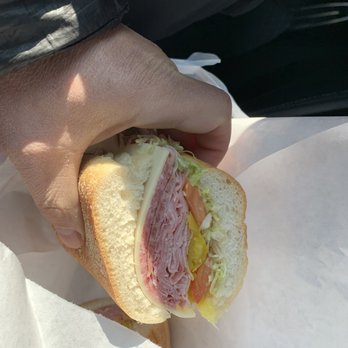 Lucky 7 Deli - a person holding a sandwich - Delis Near Me - Willow Grove, Pennsylvania Lucky 7 Deli - a person holding a sandwich - Delis Near Me - Willow Grove, Pennsylvania