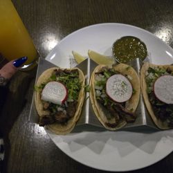 Three steak tacos and a 7 burros drink.