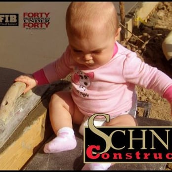 Schneider Building Group - a baby in a pink shirt playing with a hammer - General Contractors Near Me - O Fallon, Missouri Schneider Building Group - a baby in a pink shirt playing with a hammer - General Contractors Near Me - O Fallon, Missouri
