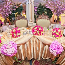 Lucy Wu Floral Design - Lucy had taken the arrangements she made for the outdoor ceremony and decorated bride and groom table.