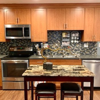 Nightingale Apartments - Kitchen with modern SS appliances, dishwasher, microwave, stove and oven. SS dual sink with detachable hose faucet. - Apartments Near Me - San Diego, California