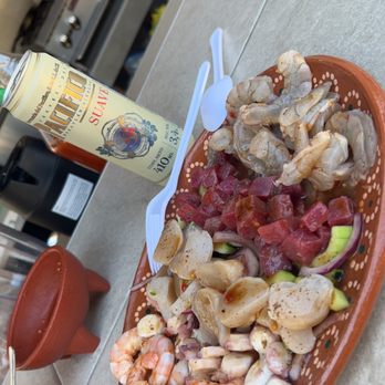 Mariscos El 47 - a plate of food and a bottle of beer - Seafood Near Me Mariscos El 47 - a plate of food and a bottle of beer - Seafood Near Me