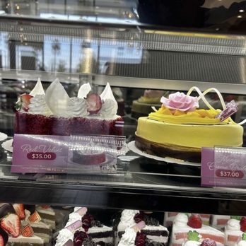 85°C Bakery Cafe-Anaheim - $37 mango cake.  Not long ago it was $29, then $32 now $37.  And it's thinner, same as their tiramisu cake. - Bakeries Near Me - Anaheim, California