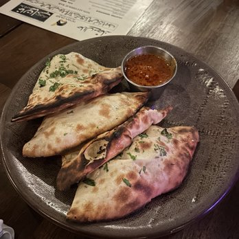 Khan Saab Desi Craft Kitchen - Goat Cheese Kulcha with Butter Sauce - Pakistani Near Me - Fullerton, California Khan Saab Desi Craft Kitchen - Goat Cheese Kulcha with Butter Sauce - Pakistani Near Me - Fullerton, California