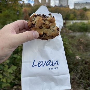 Levain Bakery - Enjoying a double Two Chip Chocolate Chip Cookie in Central Park - Bakeries Near Me - New York, New York