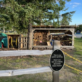 Flight Deck Brewing - a log pile and a sign - Breweries Near Me - Brunswick, Maine