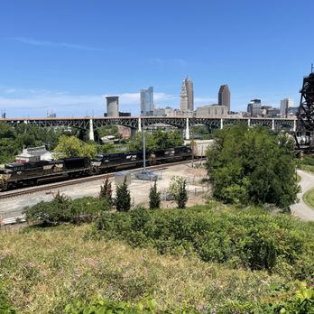 Cleveland Script Sign - Tremont - The breathtaking view of the skyline, as viewed from Tremont.  Notice the beautiful and powerful train passing through. - Landmarks & Historical Buildings Near Me - Cleveland, Ohio