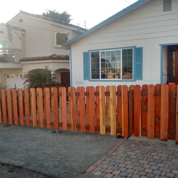 Kestrel Landscapes - a wooden fence in front of a house - Landscaping Near Me