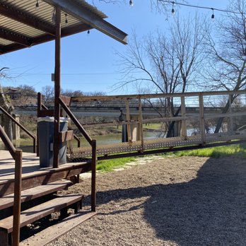 Sexton Feed Mill - Outdoor seating boasts river views and sunshine - Axe Throwing Near Me - Glen Rose, Texas Sexton Feed Mill - Outdoor seating boasts river views and sunshine - Axe Throwing Near Me - Glen Rose, Texas