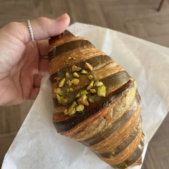 Le Shop - Pistachio croissant with pistachio cream inside - Coffee & Tea Near Me - Sarasota, Florida