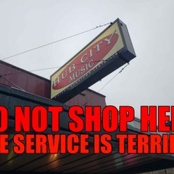 Hub City Music & Sound - A picture of the Hub City Music storefront with the text "Do not shop here. The service is terrible" overlaid.